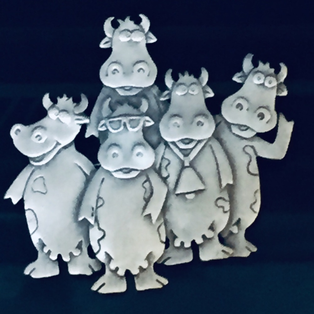 Pewter five cow brooch